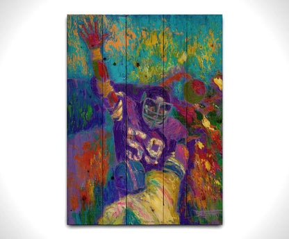 A painting of Minnesota Viking's linebacker Matt Blair waving. Painted in a vibrant pallete with visible pallete knife and brushstrokes. Printed on a wood pallet.