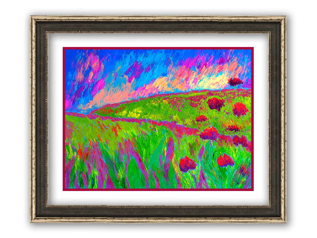 A painting of the morning sunrise over a hilly meadow of bright green grass and pink and red flowers. Printed on paper, matted, and framed.