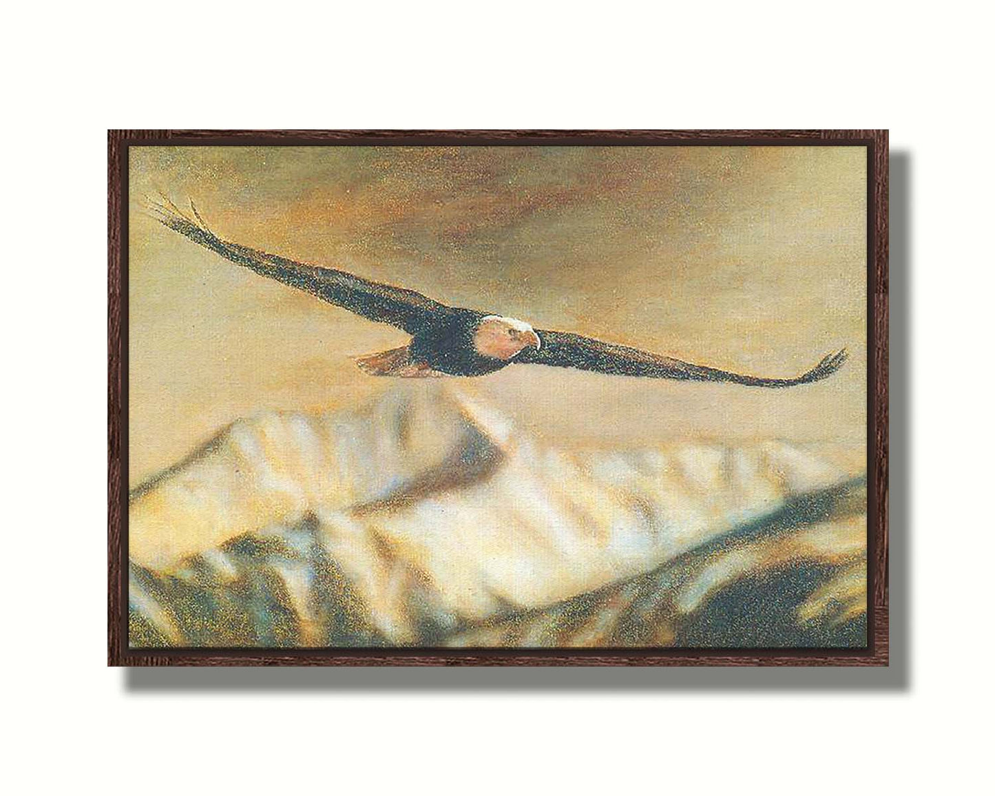 A painting of an eagle soaring over the mountains with warm brown tones. Printed on canvas in a float frame.