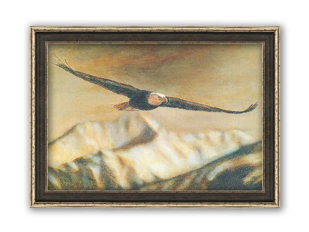 A painting of an eagle soaring over the mountains with warm brown tones. Printed on canvas and framed.