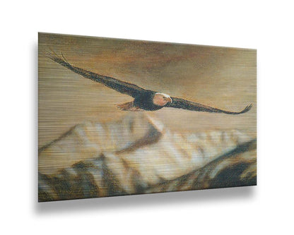 A painting of an eagle soaring over the mountains with warm brown tones. Printed on metal.