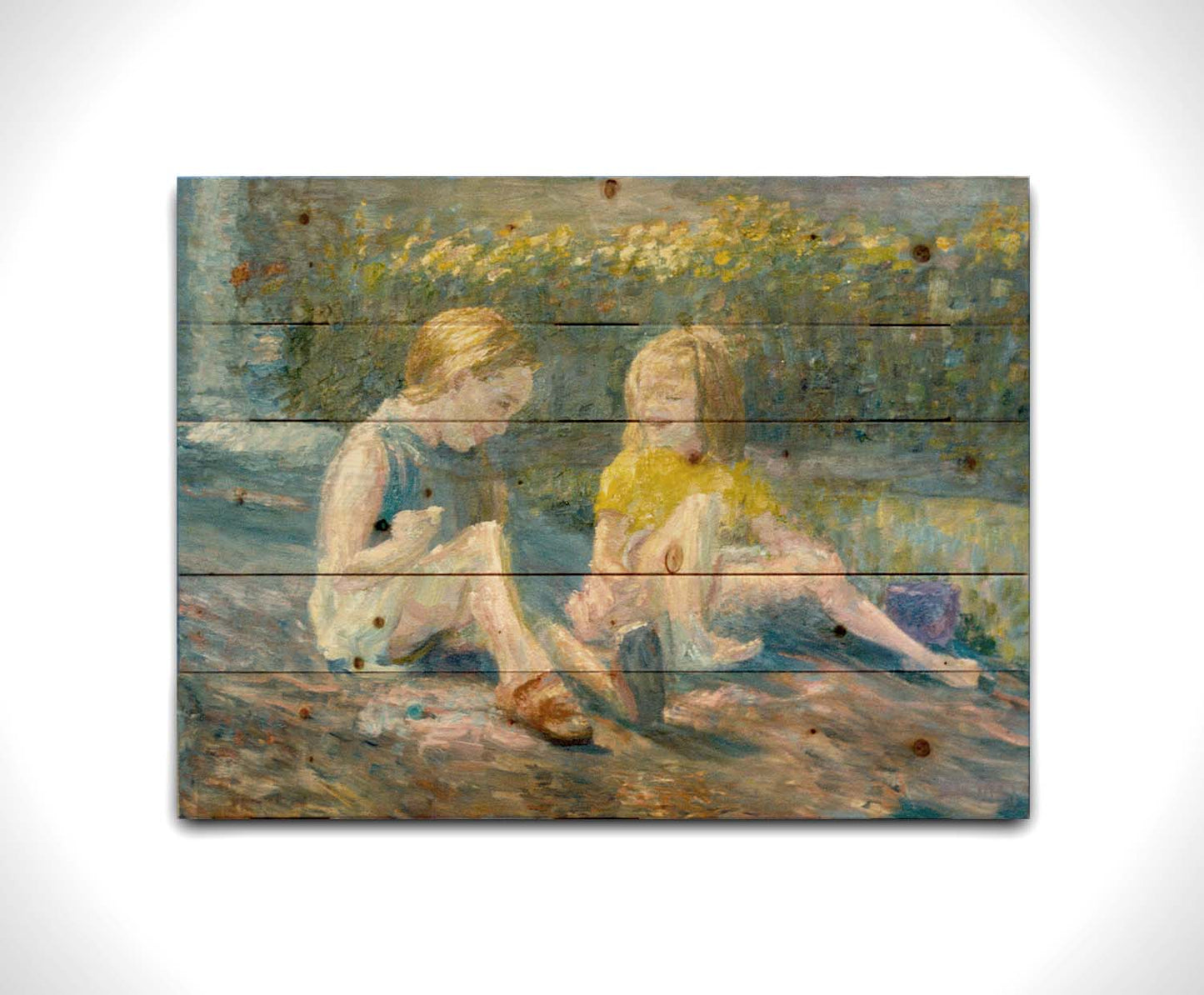 A painting of two children sitting outside in a garden of yellow flowers, laughing. Printed on a wood pallet.