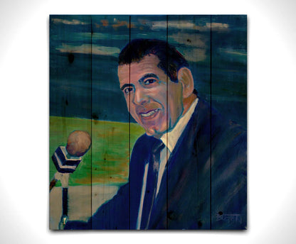 A painting of sportscaster Herb Carneal, play-by-play commentator for the MInnesota Twins baseball team. He is dressed in a suit, sitting at a microphone. Printed on a wood pallet.