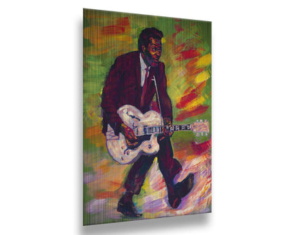 A painting of musical legend Chuck Berry, known as "the father of rock and roll", performing and playing guitar with his signature showmanship. Printed on metal.