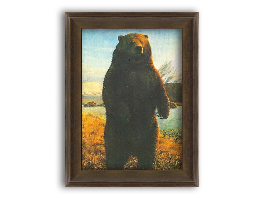 A portrait painting of a brown bear standing on its back legs in a yellow field, next to a lake and mountain range. Printed on canvas and framed.