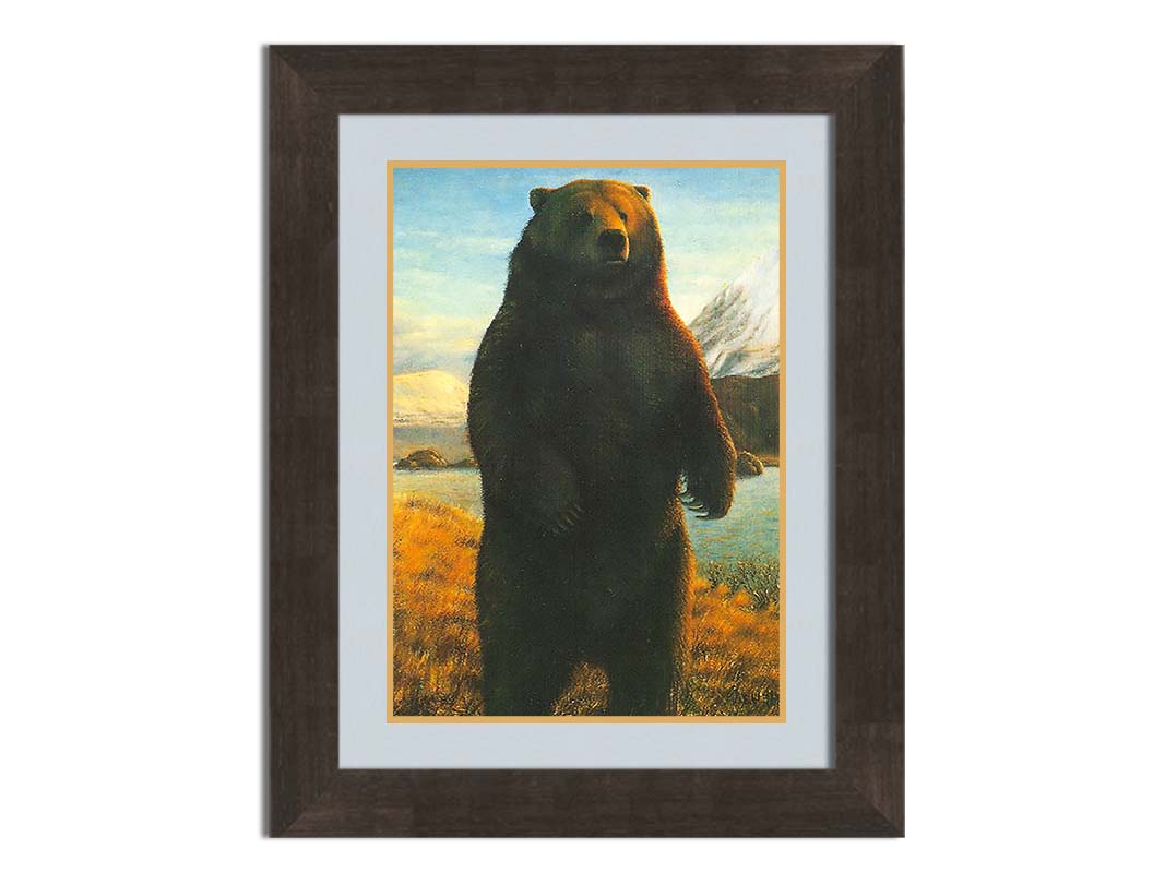 A portrait painting of a brown bear standing on its back legs in a yellow field, next to a lake and mountain range. Printed on paper, matted, and framed.