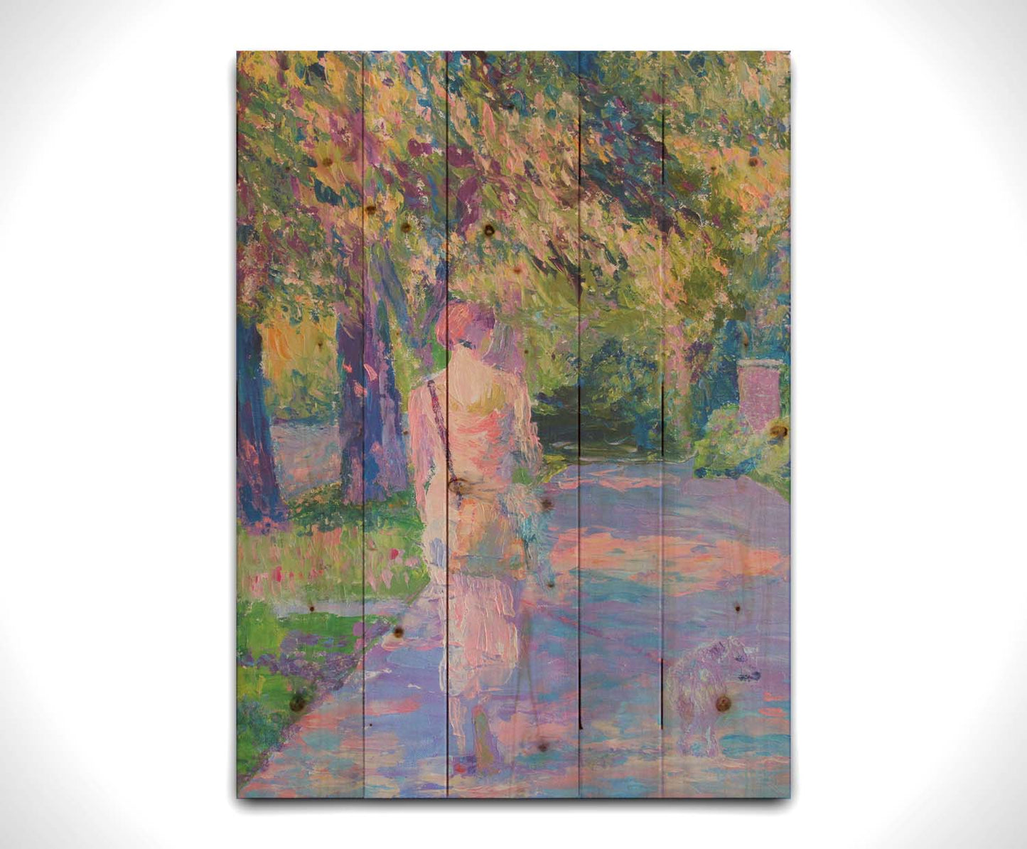 A painting of a woman walking her dog along a city sidewalk through a park. The leaved are turning yellow and red. Printed on a wood pallet.