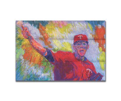 A painting of Minnesota Twins baseball pitcher JosÃ© Berrios throwing a ball. Printed on a box board.