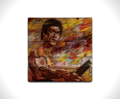 A painting of martial artist and actor Bruce Lee, holding nunchaku. It is painted with visible palette knife and brushstrokes in a palette primarily consisting of purples and reds. Printed on a wood pallet.