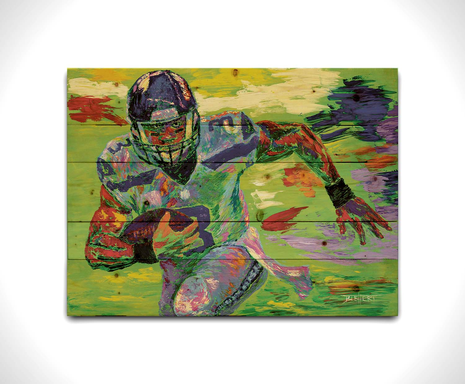 A painting of Seattle Seahawks' quarterback Russell Wilson running the football down the field. Printed on a wood pallet.