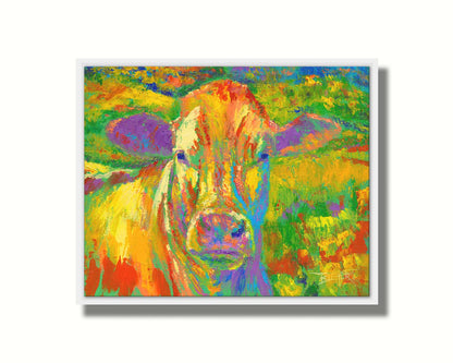 A painting of a cow standing in a pasture. It is painted in arbitrary colors, using a broad spectrum of bright colors from red through purple. Printed on canvas in a float frame.