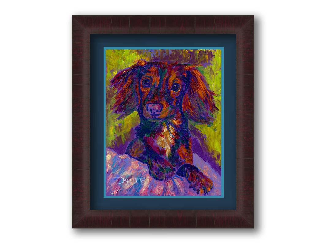 A painting of a dachshund, or wiener dog, lying on a cushion or blanket. It is perking up playfully, and it is painted using a purple, green, and brown palette. Printed on paper, matted, and framed.