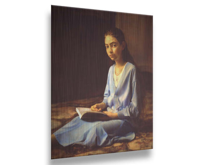 A portrait painting of a young girl dressed in blue and sitting on the floor, reading a book. It is painted in a softly lit, realistic, classical style reminiscent of the Renaissance. Printed on metal.