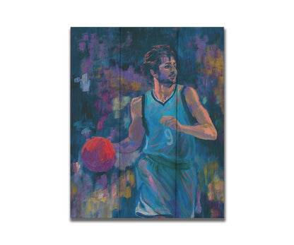 A portrait of MInnesota Timberwolves basketball player Ricky Rubio, dribbling the ball. The dark blue background, abstract and accented with purple and yellow, contrasts the lighter blue of his uniform and the bright orange ball. Printed on a box board.