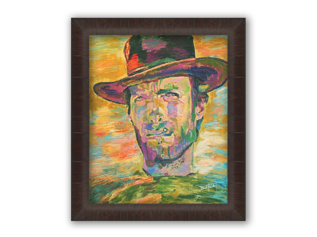 A portrait painting in yellows and greens of actor Clint Eastwood dressed for his classic western roles. Printed on canvas and framed.