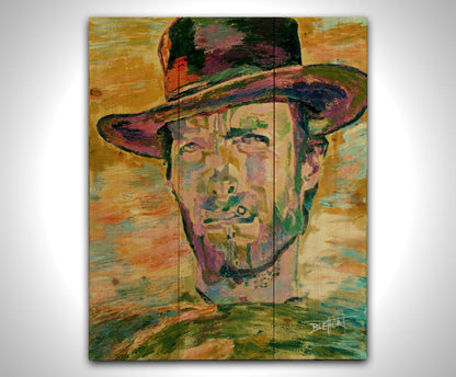 A portrait painting in yellows and greens of actor Clint Eastwood dressed for his classic western roles. Printed on a wood pallet.