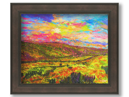 A textured, colorful impressionistic painting of a hilly meadow of flowers and an equally colorful sky. Printed on canvas and framed.