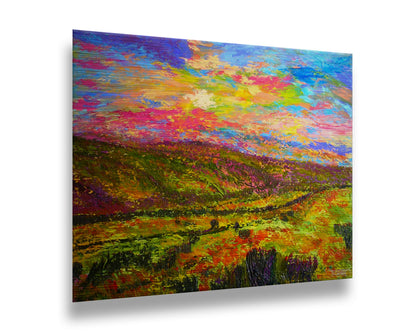 A textured, colorful impressionistic painting of a hilly meadow of flowers and an equally colorful sky. Printed on metal.