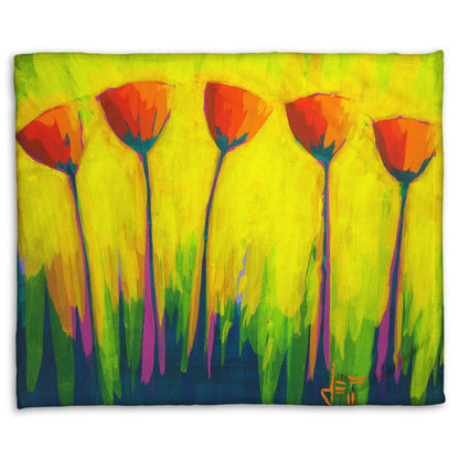 A coral fleece blanket designed with a painting of five simplified red flowers against a striking yellow and green background.