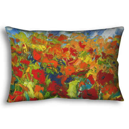 A throw pillow designed with a painting of a field of red and orange flowers, stylized in expressive large brushstrokes.