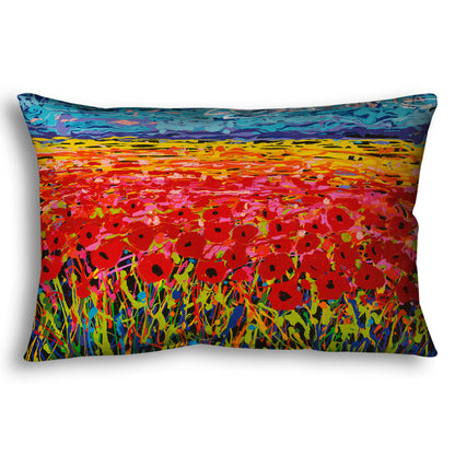 A throw pillow designed with a drip painting of a field of red flowers, created with a rainbow of vibrant colors.