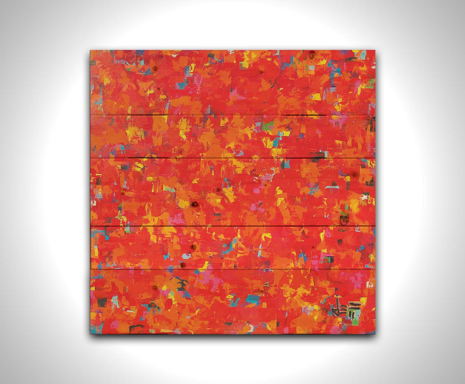 A painting of an abstract organic pattern of red, orange, and yellow accented by blue, pink, green, black, and white. Printed on a wood pallet.