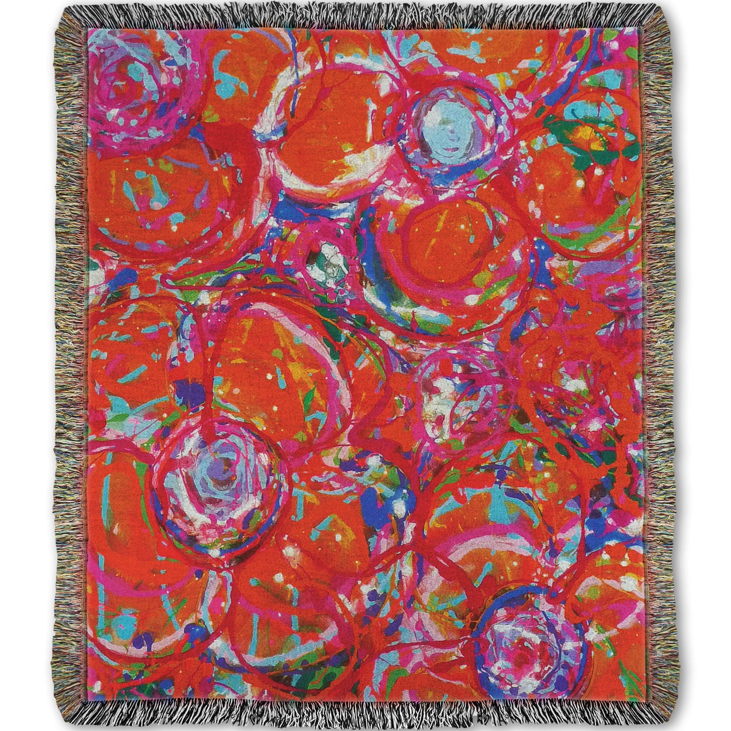 A woven throw blanket designed with a drip painting of a cluster of abstracted flowers created with splatters of orange, red, and pink with accents of green, blue, yellow, and purple.