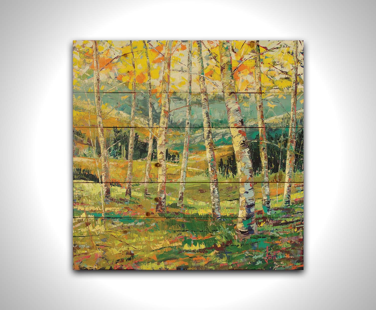 A painting of a birch forest with the yellow leaves of fall. Printed on a wood pallet.