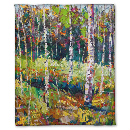 A fleece blanket designed with a painting of a birch forest in a variety of vibrant colors with textured brushwork.