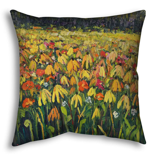 A throw pillow designed with a painting of a field of yellow coneflowers, accented by other orange, pink, red, and white wildflowers.