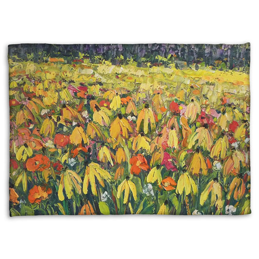 A fleece throw blanket designed with a painting of a field of yellow coneflowers, accented by other orange, pink, red, and white wildflowers.
