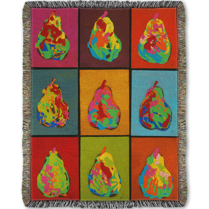 A woven throw blanket designed with a drip painting of six abstracted pears in arbitrary colors, arranged in a colorful grid of flat color panels. 