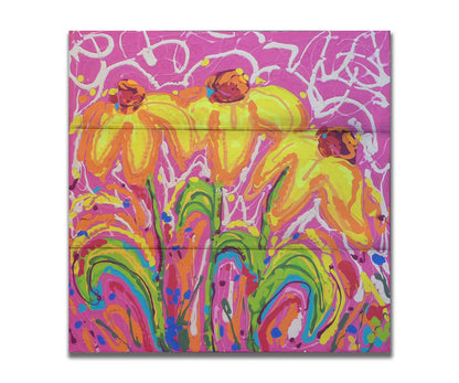 A painting of three yellow wildflowers on a pink background, accented by orange, blue, green, and white. It was created by dripping paint onto the substrate. Printed on a box board.