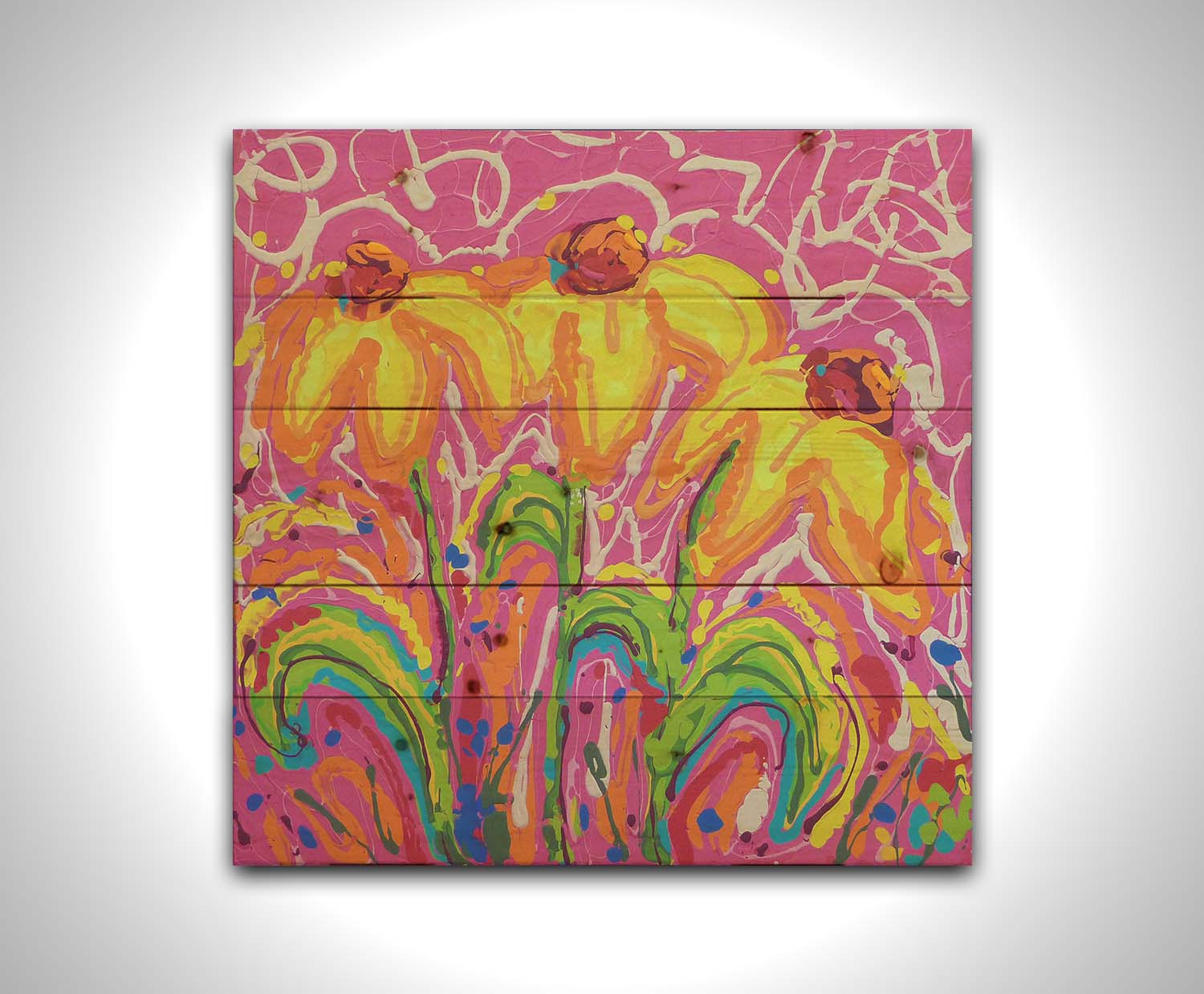 A painting of three yellow wildflowers on a pink background, accented by orange, blue, green, and white. It was created by dripping paint onto the substrate. Printed on a wood pallet.