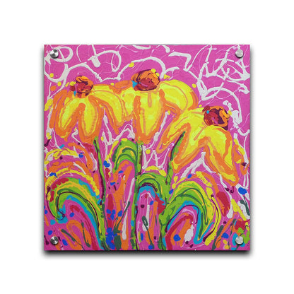 A painting of three yellow wildflowers on a pink background, accented by orange, blue, green, and white. It was created by dripping paint onto the substrate. Printed on acrylic.