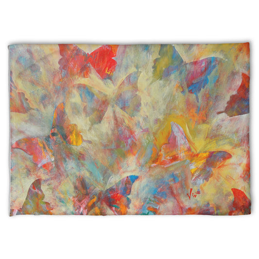 A fleece throw blanket designed with an abstracted painting of a pattern of butterflies, created in an array of colors with textured brushstrokes.