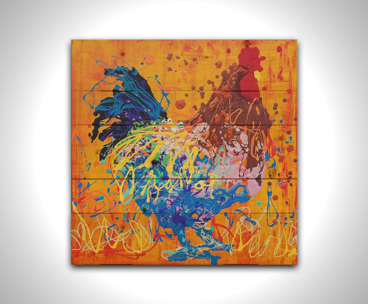 A drip painting of a brown and blue rooster on a vibrant orange background, splattered with accents of yellow, white, and red. Printed on a wood pallet.