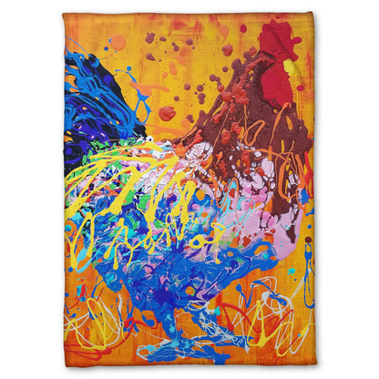 A fleece blanket designed with a drip painting of a brown and blue rooster on a vibrant orange background, splattered with accents of yellow, white, and red. 