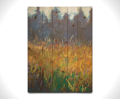 An expressive painting of a gold and green field in front of a purple and blue forest. Printed on a wood pallet.