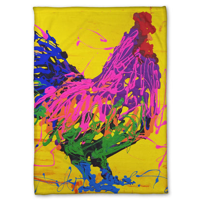 A fleece blanket designed with a drip painting of a pink and purple rooster on a bright yellow background, accented with blue and green.