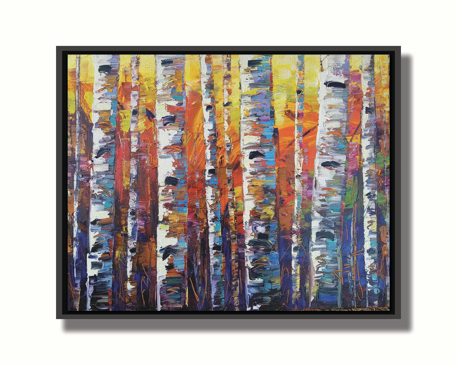 A colorful painting of a forest of birch trees in arbitrary color, with white trunks against a yellow, red, and blue background made of large swaths of pallet knife paint. Printed on canvas in a float frame.