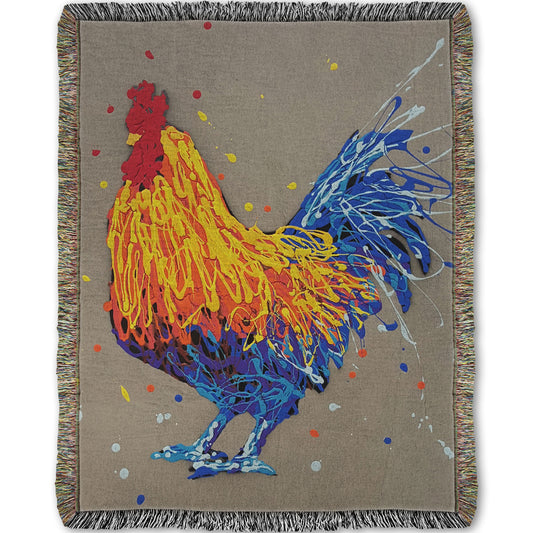 A woven throw blanket designed with a drip painting portrait of a rooster in red, orange, yellow, blue, and purple against a gray background.