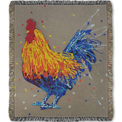 A woven throw blanket designed with a drip painting portrait of a rooster in red, orange, yellow, blue, and purple against a gray background.