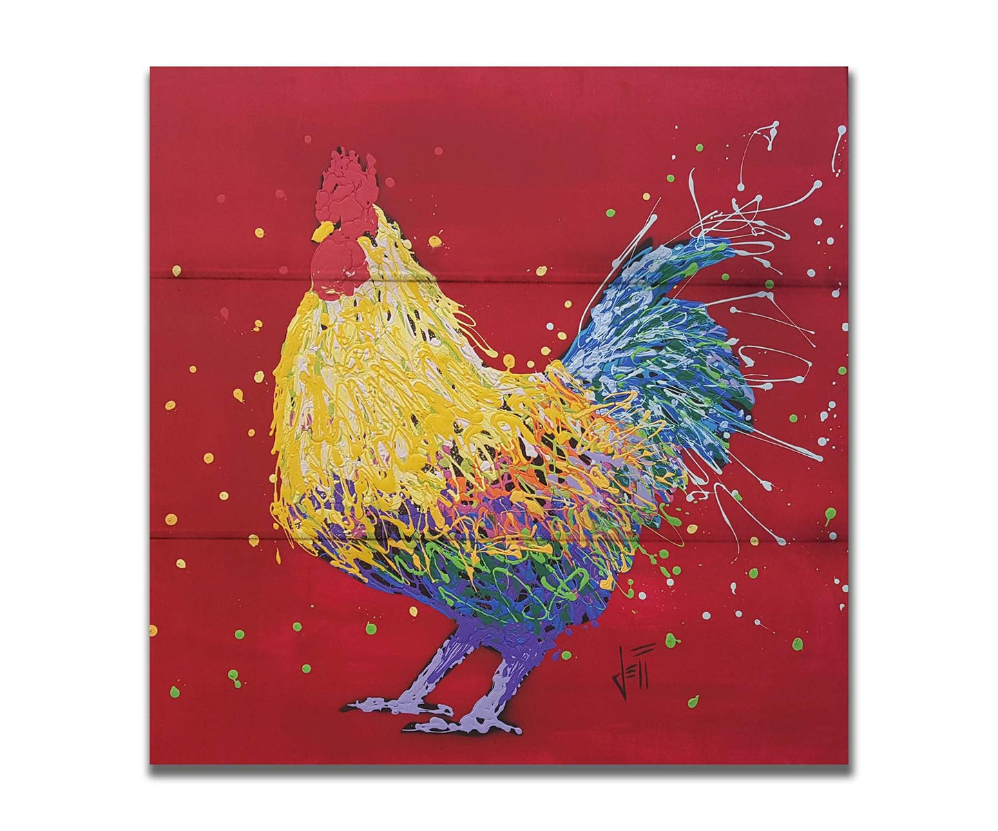 A drip painting of a multicolored rooster on a red background, accented with dots and splatters of yellow and green. Printed on a box board.