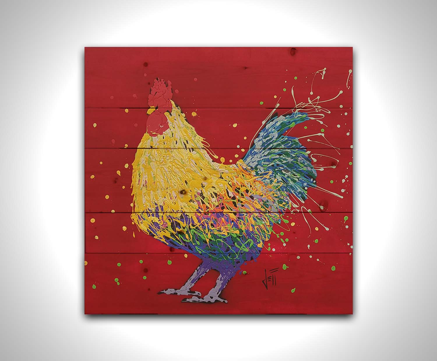 A drip painting of a multicolored rooster on a red background, accented with dots and splatters of yellow and green. Printed on a wood pallet.