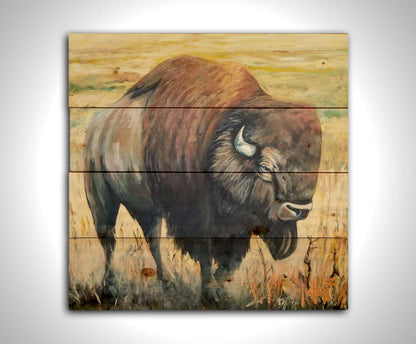 A paintng of an American bison, standing in a light yellow field. Printed on a wood pallet.