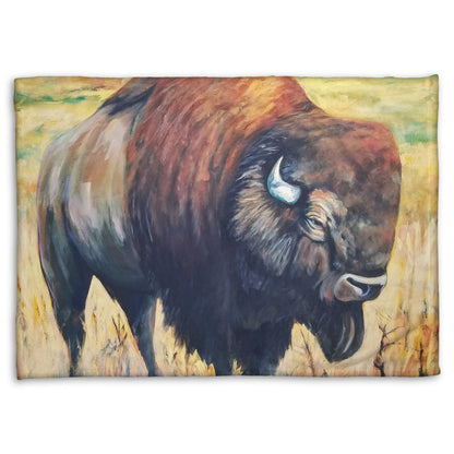 A fleece throw blanket designed with a painting of an American bison, standing in a light yellow field.