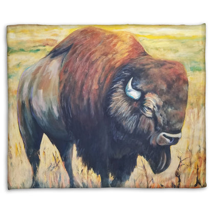 A fleece throw blanket designed with a painting of an American bison, standing in a light yellow field.