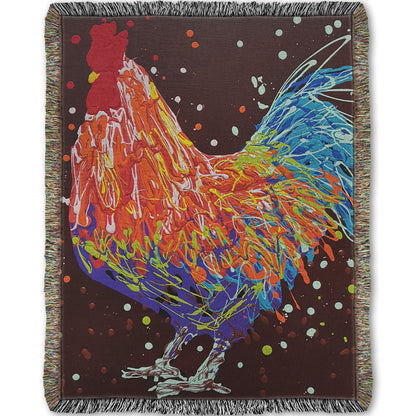 A woven throw blanket designed with a drip painting of an orange, blue, and red rooster against a brown background.