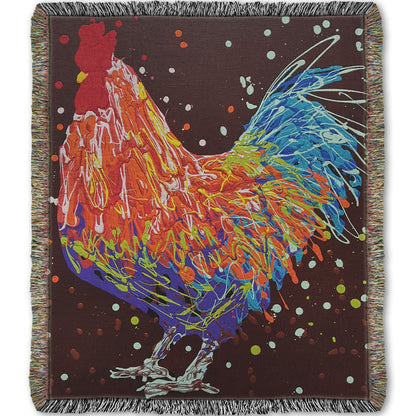 A woven throw blanket designed with a drip painting of an orange, blue, and red rooster against a brown background.